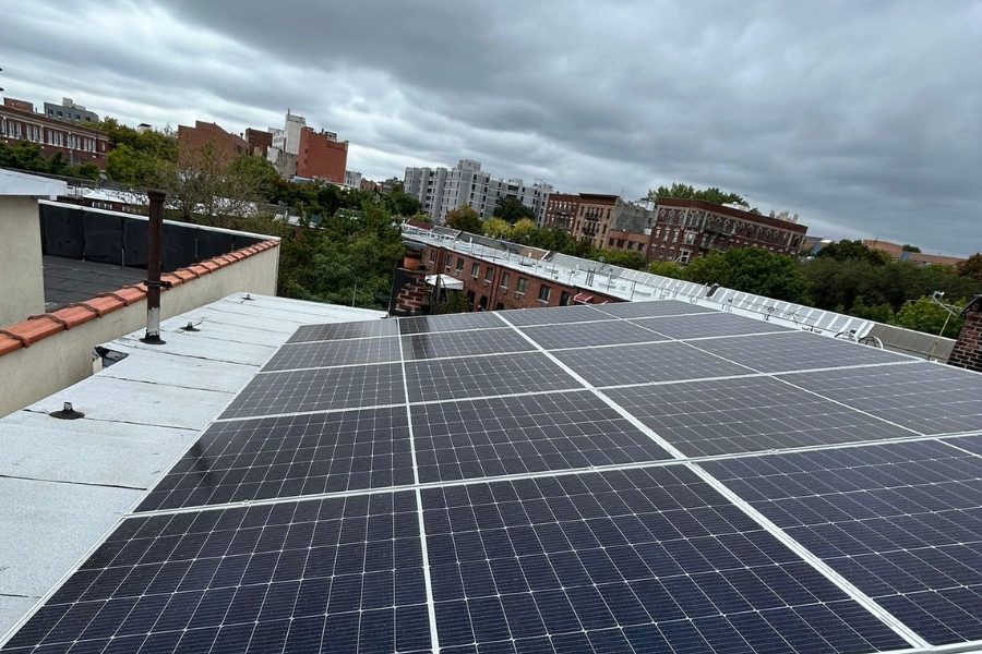 solar panels on home with grey clouds