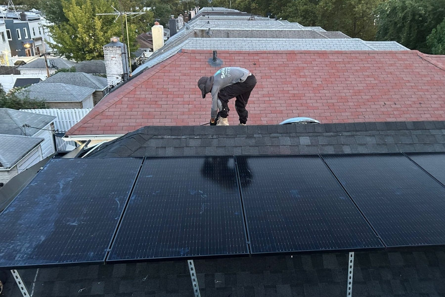 solar panel contractor installing solar panels on a roof in brooklyn