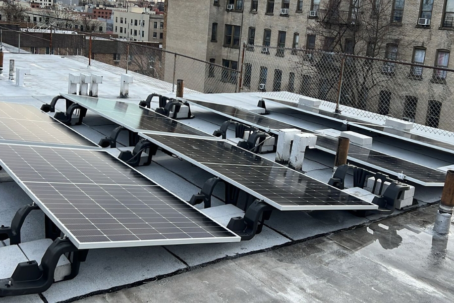 commercial solar panels on top of a roof in New York
