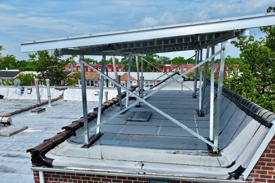 bifacial solar panel installation on top of a roof