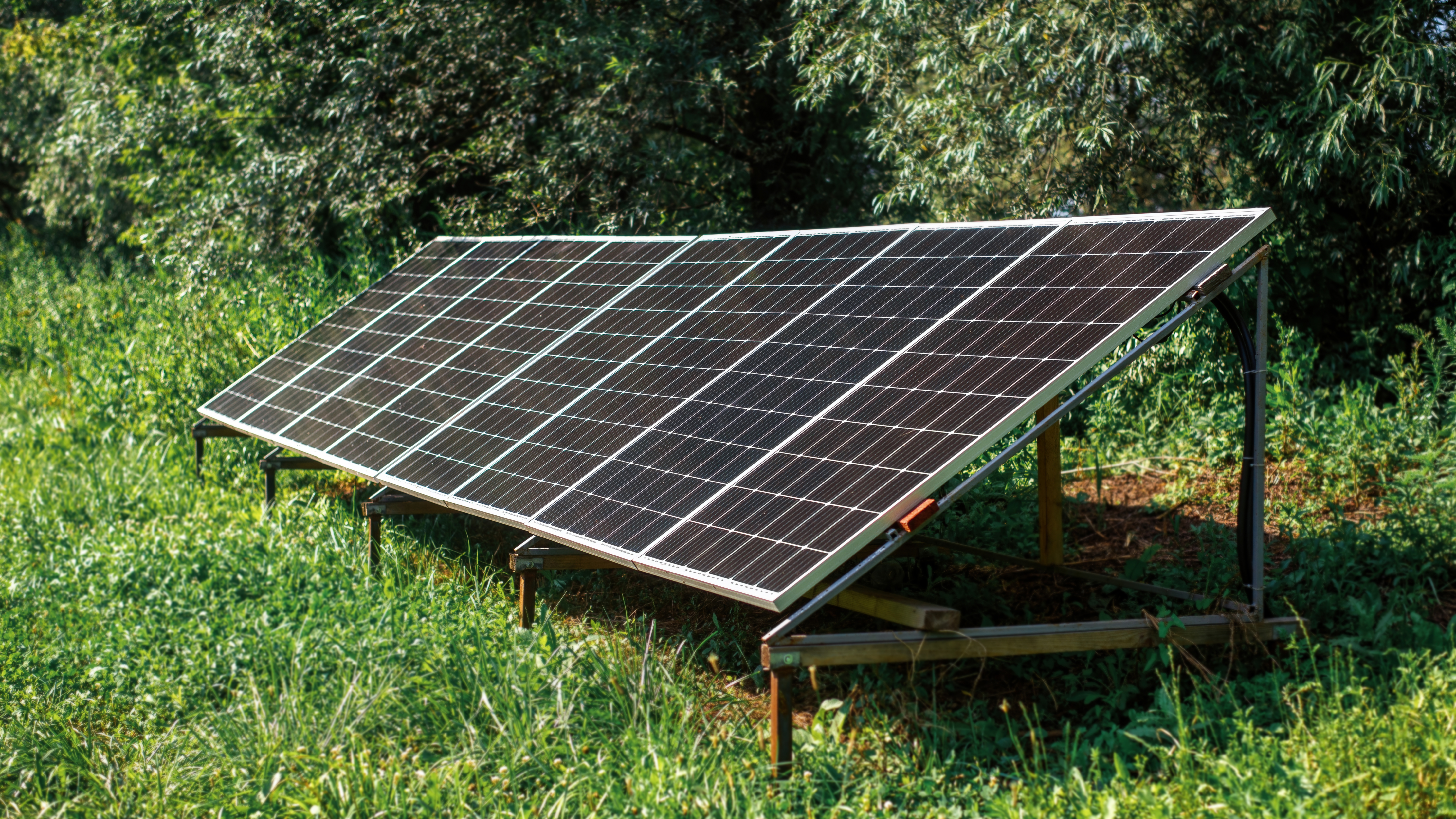 Solar panels on the ground in the nature off grid solar panels on grass