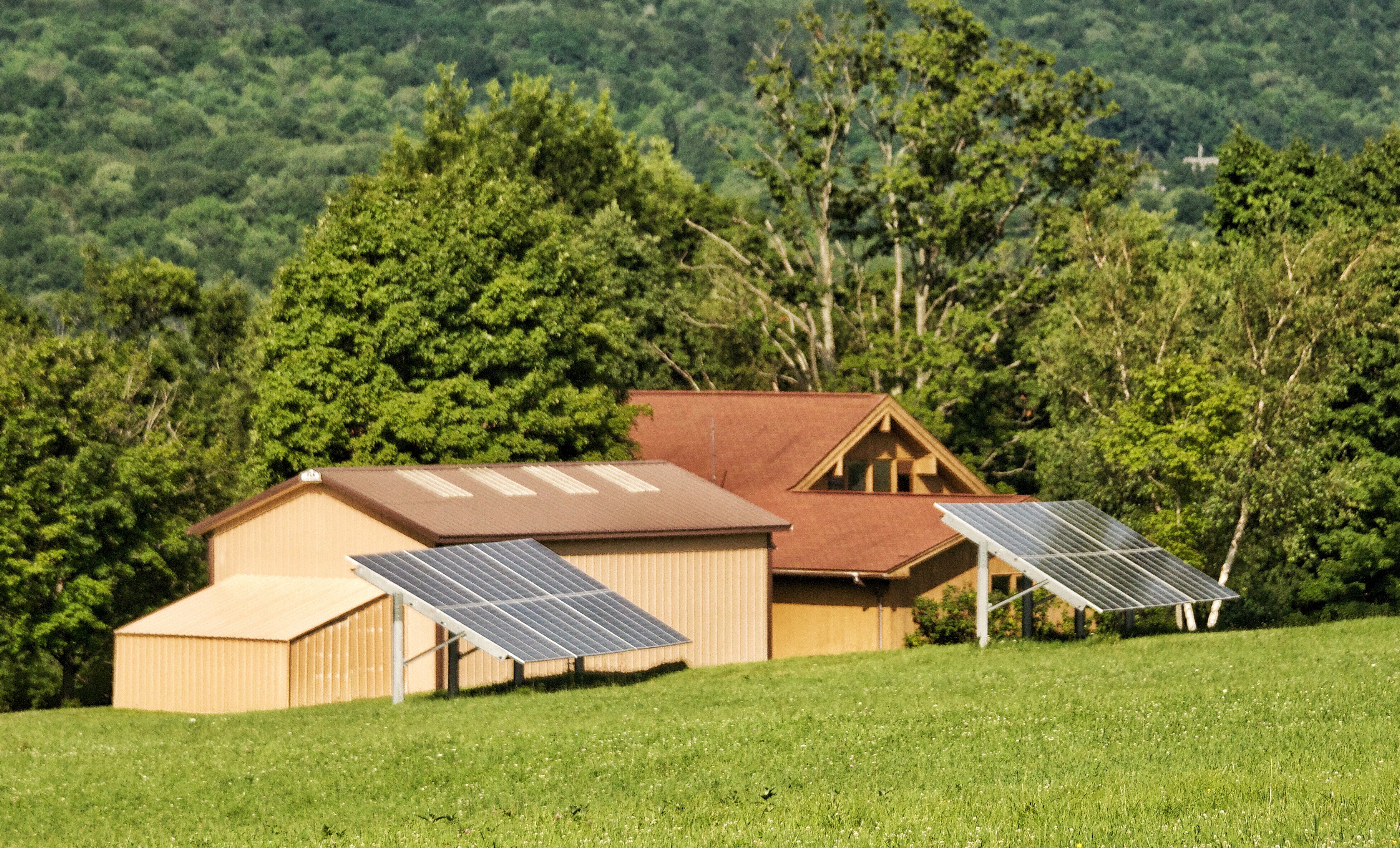 Solar panels on the ground in the nature off grid home with solar panels on a green field